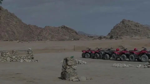 Red quad standing in Sinai mountains near Sharm el Sheikh - Egypt Stock Footage 235918656