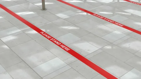 Red queue lines on the floor and social distance in the public places Видео 139530593