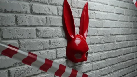 red rabbit mask on a white brick texture... | Stock Video | Pond5