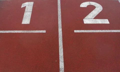 Red race track surface with two lanes Stock Photos