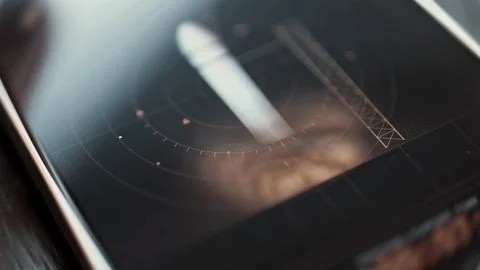 Red radar lines intersect rocket at launch pad Stock Photos