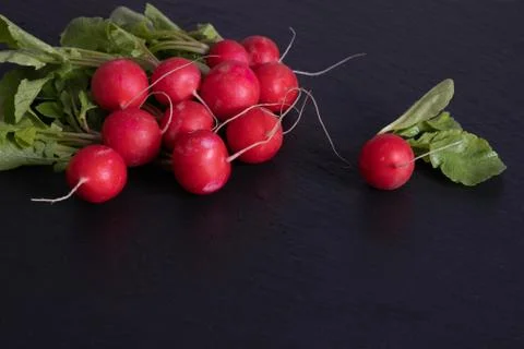 Red radish lies on a table Stock Photos