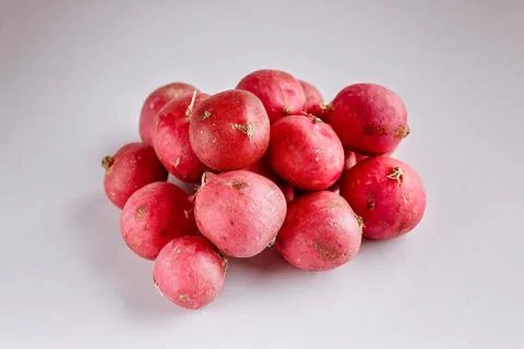 Red radish on a light gray background. Fresh and healthy vegetables. Organic  Stock Photos