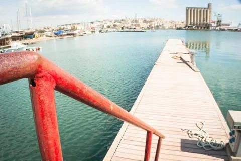Red railing at the pier Stock Photos