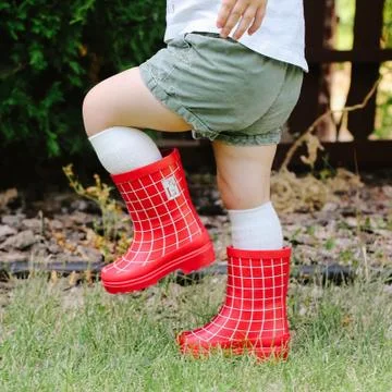 Red Rain Boots enjoy children Stock Photos