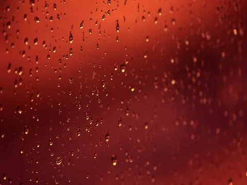 Red rain drops on window Stock Footage 76678298