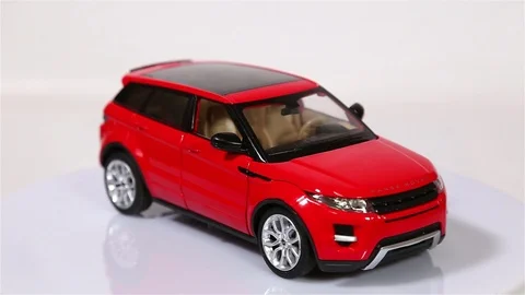 Red Range Rover Evoque scale model suv car is rotating isolated on white 스톡 동영상 101688265