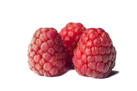 Red raspberry berries close-up isolated on a white background. sweet summer m Stock Photos