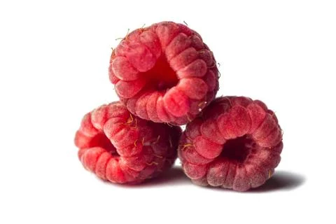 Red raspberry berries close-up isolated on a white background. sweet summer m Stock Photos