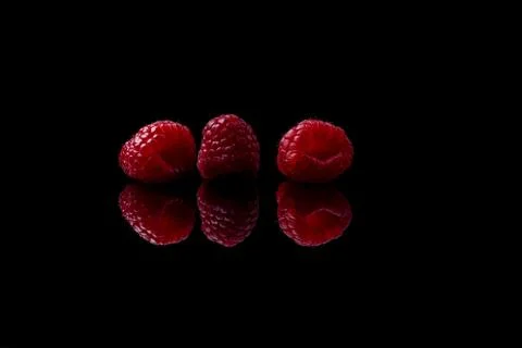 Red raspberry on black background Foto stock
