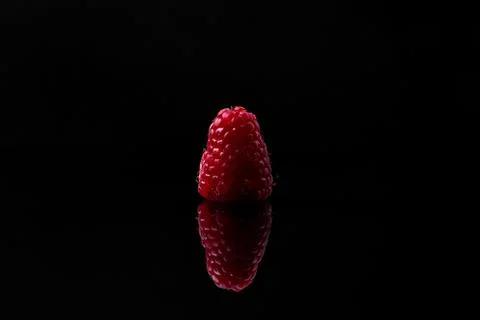Red raspberry on black background Stock Photos