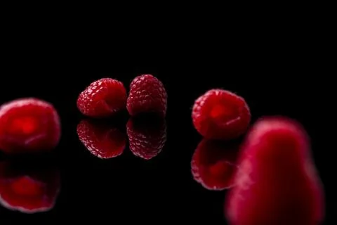 Red raspberry on black background Stock Photos