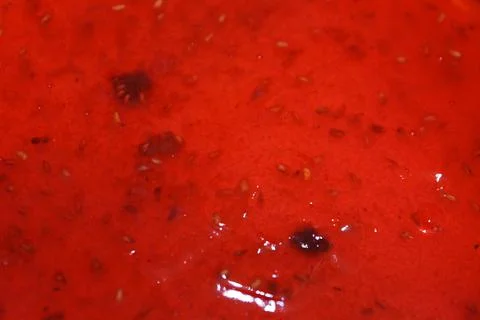 Red raspberry jelly texture close up for food background Stock Photos