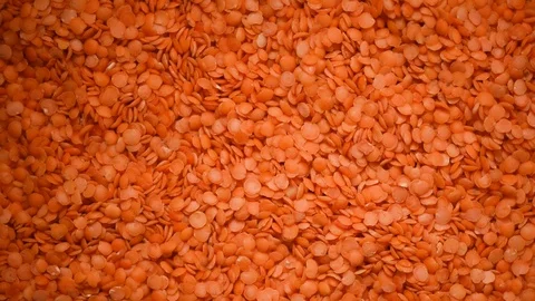 Red raw organic lentils texture rotation. Food ingredient background. Top view Stock Footage 122185457