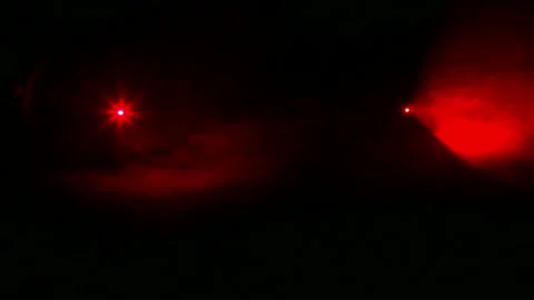 The red rays of the profile lights in the dark in a smoke blanket Stock Footage 123488624