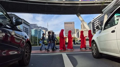 Red Rebel Brigade Silent Protest at African Energy Week, Cape Town 2025 Stock Footage 337914011