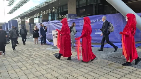 Red Rebel Brigade Silent Protest at African Energy Week, Cape Town 2025 Stock Footage 337914017