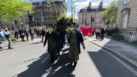 Red Rebels take part in 'Funeral for Nature' ahead of Earth Day  Stock Footage 273161444