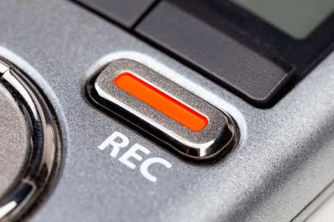 Red REC recording button on a modern pocket audio voice recorder, object Fotos Stock