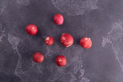 Red reddish on blue textured surface, top view. Healthy diet and nutrition 스톡 사진