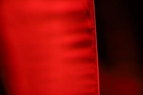 Red reflections of liquid in macro, red geometric shapes Stock Photos