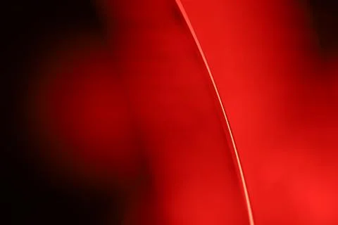 Red reflections of liquid in macro, red geometric shapes Stock Photos