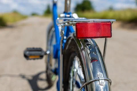 Red reflector on the trunk of a bicycle close-up Stock Photos