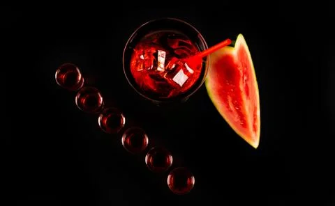 Red refreshing drink on the basis of watermelon on a black background Stock Photos