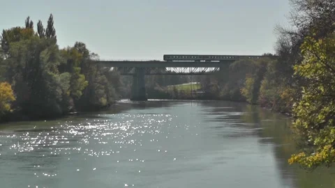 Red Regional Train Crossing Bridge over River Lech Stock Footage 309917372