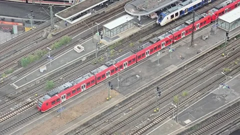 Red regional train at a railway station platform in COLOGNE Stock Footage 345096210