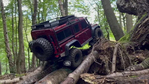 Red Remote Control Land Rover Steep Climb in Walderslade, Chatham Woods, Kent Stock Footage 253070631