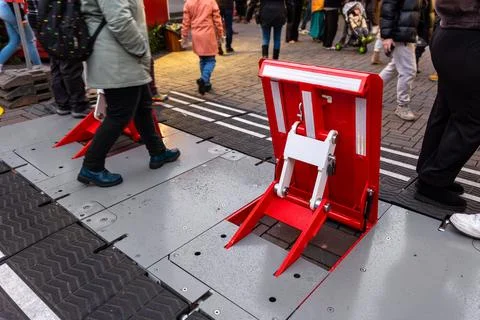 Red retractable security barrier install pedestrian zone Christmas market E.. Stock Photos