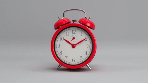 Red retro rotating alarm clock looping animated background, wake up time Stock Footage 141913833