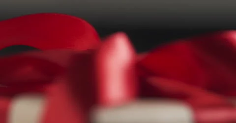 Red ribbon bow close up focus pull Stock Footage 67380448
