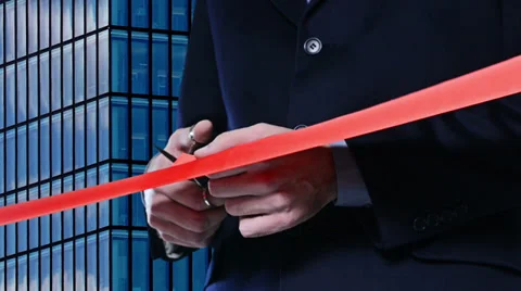 Red ribbon cutting: Hand cutting a red ribbon for inauguration Video stock 33892244