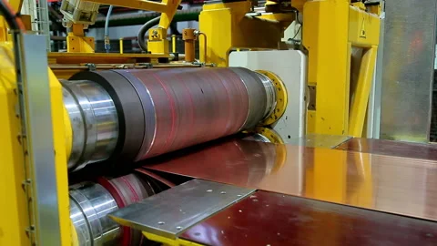The red ribbon of sheet copper rectified on the machine Video stock 103848610