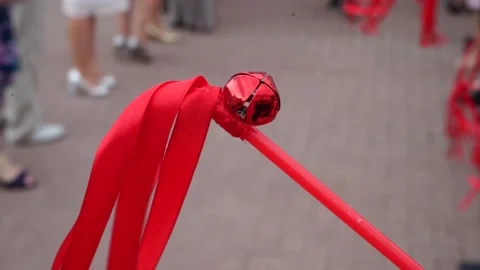 Red ribbon on a stick with a bell Stock Footage 163566596