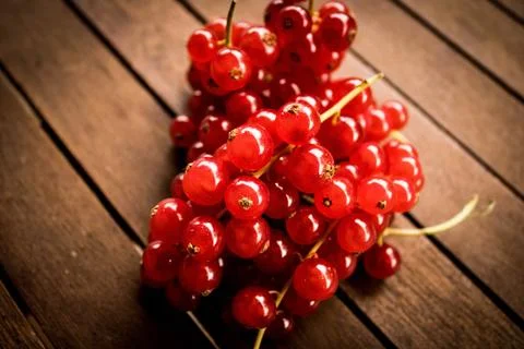 Red ribes on wood table Stock Photos