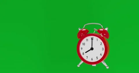 Red ringing analog alarm clock on green ... | Stock Video | Pond5