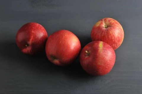 Red ripe apple on a dark rustic wooden background Stock Photos