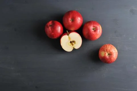 Red ripe apples on a dark rustic wooden background Stock Photos