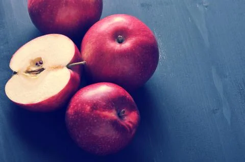 Red ripe apples on a dark rustic wooden background Stock Photos