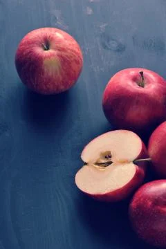 Red ripe apples on a dark rustic wooden background Stock Photos