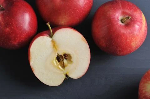 Red ripe apples on a dark rustic wooden background Stock Photos