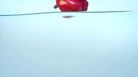 Red ripe bell pepper in water in slow motion Stock Footage 76551853