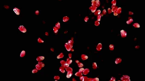 Red ripe garnet grains bouncing against to the camera Stock Footage 88492727