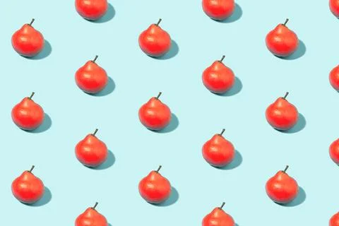 Red ripe pears on a mint background Fotos Stock
