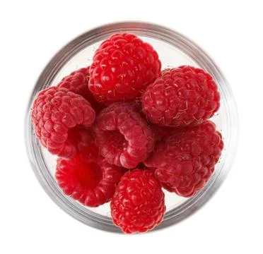 Red ripe raspberry fruit in transparent glass, isolated on white macro Foto stock