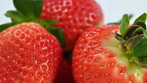 Red ripe strawberries on white background, macro closeup Stock Footage 301447920