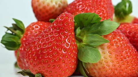 Red ripe strawberries on white background, macro closeup Stock Footage 301448009